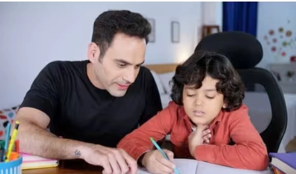 Parent helping child with homework